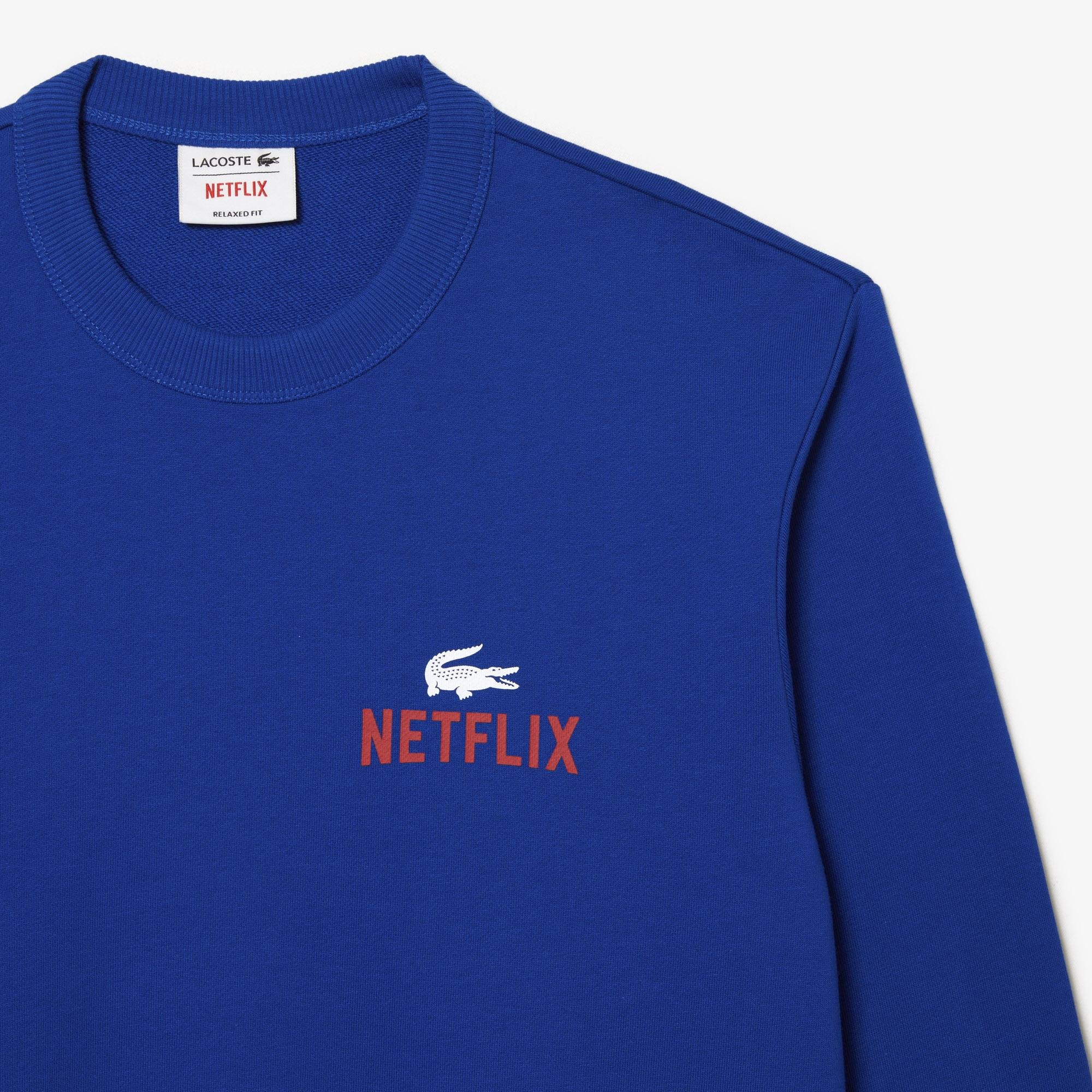 Lacoste x Netflix Unisex Regular Fit Bisiklet Yaka Baskılı Mavi Sweatshirt. 7